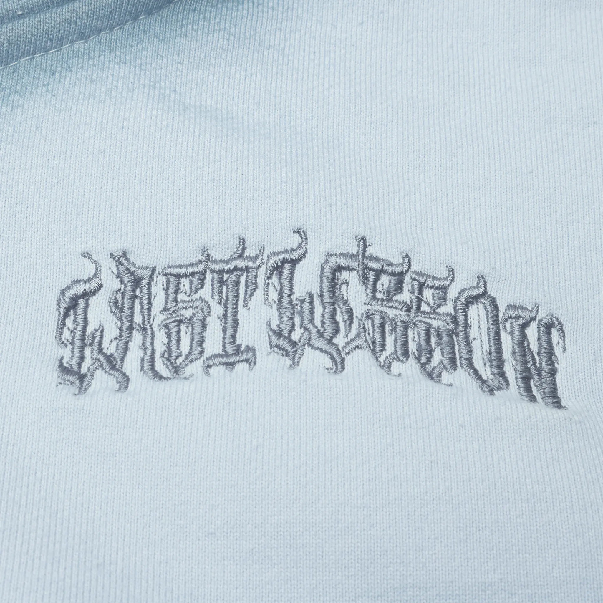 Detailed Logo View of Last Lesson Sprayed Blue Hoodie
